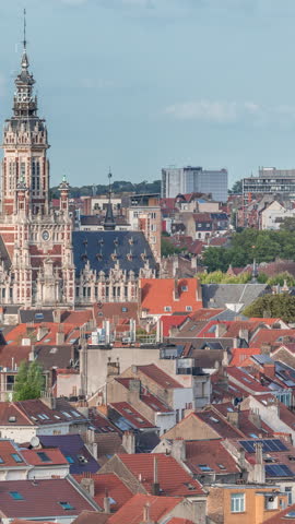 Aerial view of Schaerbeek Town Hall timelapse in Brussels, Belgium. Neo-Renaissance architecture surrounded by red-roofed houses under a blue cloudy sky. Scenic cityscape and historical charm