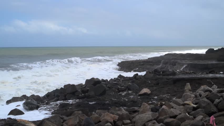 Rocky coastal shore with crashing ocean waves