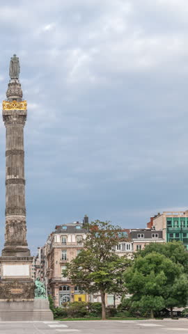 Congress Column Timelapse in Brussels, Belgium. A monumental neoclassical column on Place du Congres, commemorating the National Congress and Belgian Constitution. Skyscraper in the background