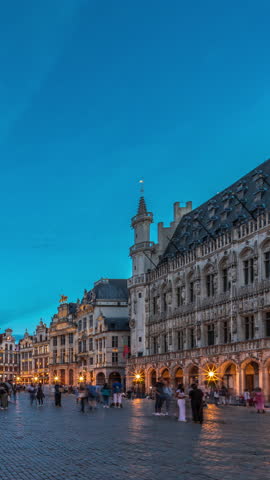 The Grand-Place (Grote Markt) day to night transition timelapse hyperlapse in Brussels, Belgium. Brabantine Gothic Town Hall, Maison Grand-Place and tourists in the historic city center after sunset