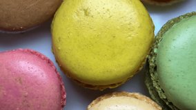 Extreme close-up of a French macaron dessert. Macro shot showing the detailed texture of the almond meringue shell and creamy filling. Delicious sweet gourmet pastry background - Powered by Shutterstock - Get 15% off with code: PIKWIZARD15