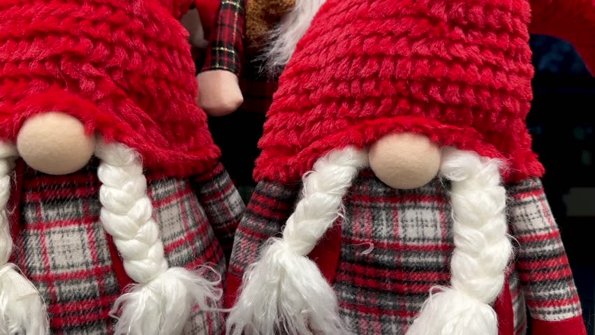 Soft Christmas toys displayed in a store. Festive plush decorations, holiday figures and seasonal gifts on shelves