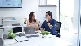 Adult Asian professionals celebrate project success. Financial goals met. Collaborative effort drives innovation professional growth within modern office setting. - Powered by Shutterstock - Get 15% off with code: PIKWIZARD15