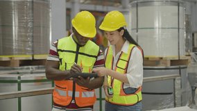 Diverse industrial team. African American man worker recording data on tablet, Asian woman engineer holding tape measure. Factory quality control, metal coil packaging inspection - Powered by Shutterstock - Get 15% off with code: PIKWIZARD15