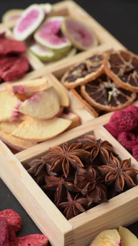 Box of dried fruits strawberries, raspberries, figs and peaches as ingredients for desserts. Dried fruits as food background