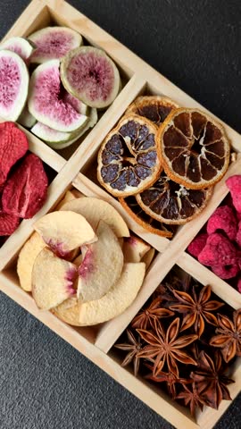 Box of dried fruits strawberries, raspberries, figs and peaches as ingredients for desserts. Dried fruits as food background