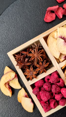 Box of dried fruits strawberries, raspberries, figs and peaches as ingredients for desserts. Dried fruits as food background