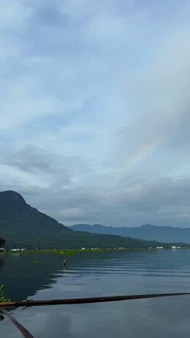 lake and hills in the morning with blue sky