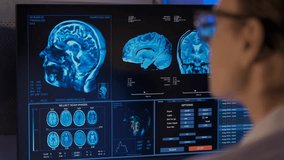 A woman doctor analyzes an MRI scan in a hospital office, highlighting medical expertise, diagnostic process, healthcare technology, and professional clinical work. - Powered by Shutterstock - Get 15% off with code: PIKWIZARD15