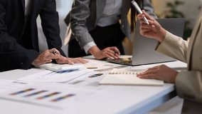 Business people analyzing financial charts and documents. - Powered by Shutterstock - Get 15% off with code: PIKWIZARD15