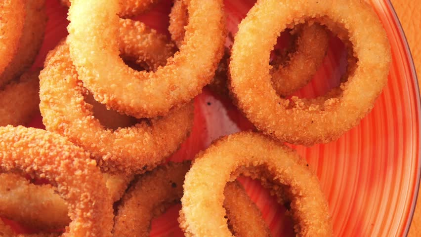 Crispy onion rings prepared in a cozy kitchen setting