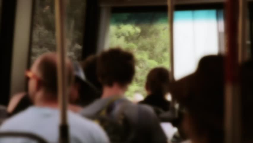Tourists sitting on a shuttle at Zion National Park in Southern Utah