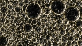 Golden macro oil bubbles forming abstract liquid pattern with floating spheres and shimmering texture - Powered by Shutterstock - Get 15% off with code: PIKWIZARD15
