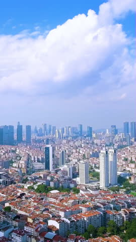 4K aerial vertical video of Istanbul skyline featuring Levent skyscrapers and residential roofs under clouds. Cinematic drone footage of modern Turkey city for travel reels and mobile.