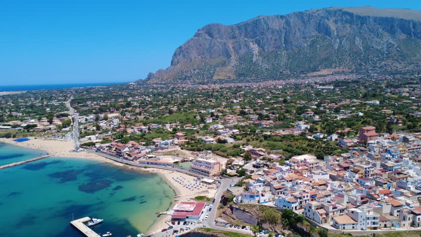 Stunning Aerial View of Coastal Town Surrounded by Mountains and Clear Blue Waters in Sicily. Terrasini, Sicily, Italy
