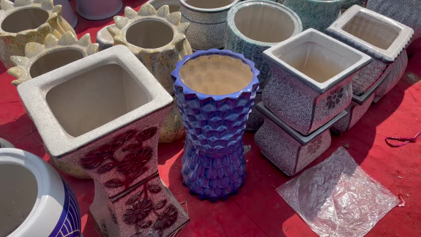 Colorful Ceramic Flower Pots Displayed at Outdoor Garden Market