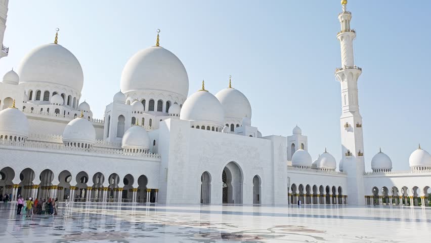 Sheikh Zayed Grand Mosque in Abu Dhabi, United Arab Emirates. One of largest mosques in the world. White marble domes and columns. 4K video footage