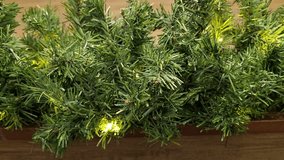 Dynamic product video of the Snowtime artificial Christmas garland, highlighting its realistic texture and beautifully integrated warm white lighting. - Powered by Shutterstock - Get 15% off with code: PIKWIZARD15
