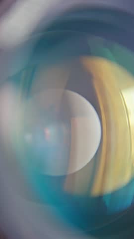 lens aperture details, magnified shot highlighting aperture blades and interior reflections, close examination of camera lens revealing geometric bokeh and intricate interior reflections