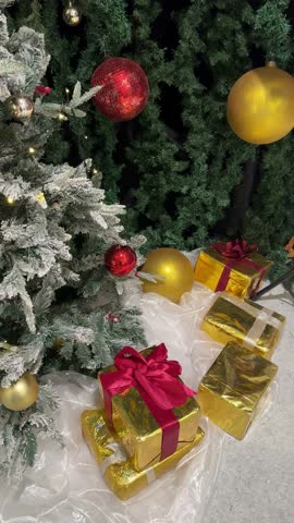 4k footage of christmas santa claus and christmas tree decoration with twinkle lights and interactive spotlights. Christmas pop up ornaments and decoration