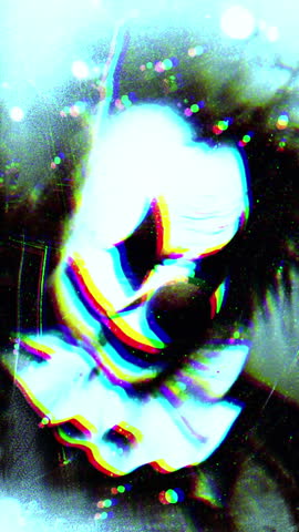 Glitch Art Portrait Of A Neon Blue Clown Mask With Distorted Facial Features And Surreal Glow Vertical Video