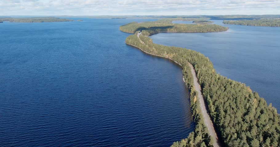 Aerial view of Pulkkilanharju ridge road on the Päijänne lake in Finland, a route famously voted the country´s most scenic road in 2014, on a sunny autumn day.