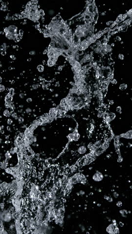 Super Slow Motion Shot of Real Water Splash Isolated on Black at 1000fps.
