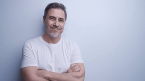 Portrait of mature age, middle age, mid adult casual man in 50s, happy confident smile, standing at wall. White background, copy space. - Powered by Shutterstock - Get 15% off with code: PIKWIZARD15