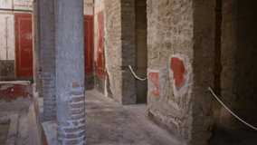 Pompeii ruins interior with soft defocused background showing aged brick, frescoed walls, columns and stone texture; background backplate copyspace calm. - Powered by Shutterstock - Get 15% off with code: PIKWIZARD15
