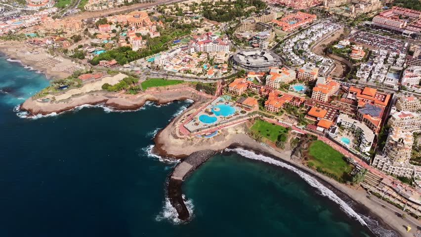 Stunning aerial sweep of Costa Adeje’s beach promenade and ocean views
