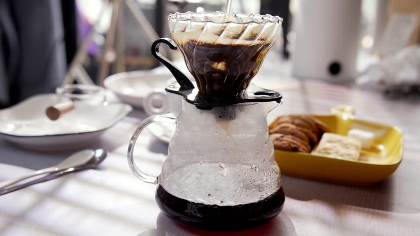 Fresh Coffee Grounds Sitting in Filter as Brew Begins for Person Barista. Filling Space with Aroma, Warmth and Calm. Simple and Comforting Ritual that Highlights Taste Morning Focus Close-up 4k