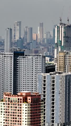 Makati Skyline. Business buildings and high rise condominiums. Metro Manila Cityscape. Philippines. Vertical view.