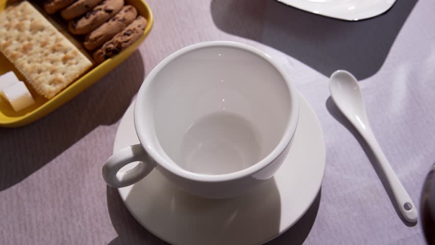 Fresh Brewed Hot Coffee Is Carefully Poured Into Cup. Filling Morning with Warm Aroma Comfort and Sense Of Peace. Simple Daily Ritual with Black Coffee that Highlights Flavor, Warmth And Relaxation 4k