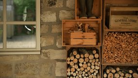 Stack of pre-prepared firewood logs and kindling at a rustic Yorkshire countryside farmhouse. Cozy rural setting highlighting traditional wood storage and farm life - Powered by Shutterstock - Get 15% off with code: PIKWIZARD15