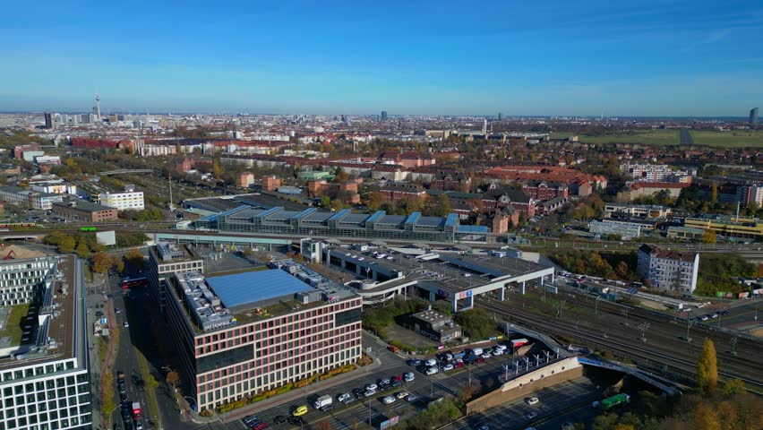 Berlin Tempelhof urban cityscape showing modern train station South Cross, railway tracks. speed ramp hyper motion time lapse Perfect aerial view flight panorama orbit drone