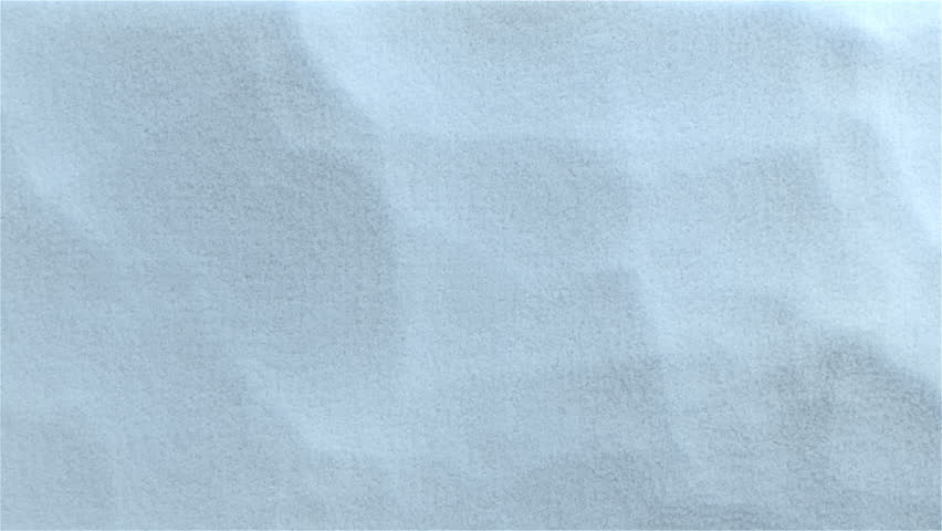 4K cinematic winter transition where fine snow particles are gently blown away from the side, revealing the background. This soft, cold wind sweep effect is ideal for holiday season promotions, Christ