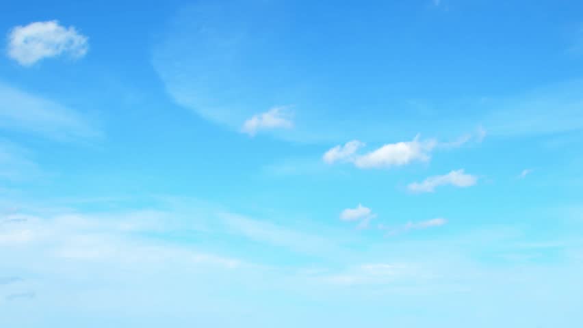 Sky with light and airy cumulus clouds. Abstract blue background with summer sky.