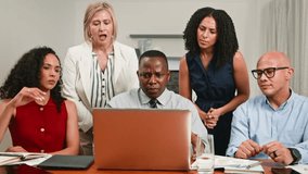 Diverse Business Team Collaborating, Focused, and Discussing Serious Matters on a Laptop - Powered by Shutterstock - Get 15% off with code: PIKWIZARD15