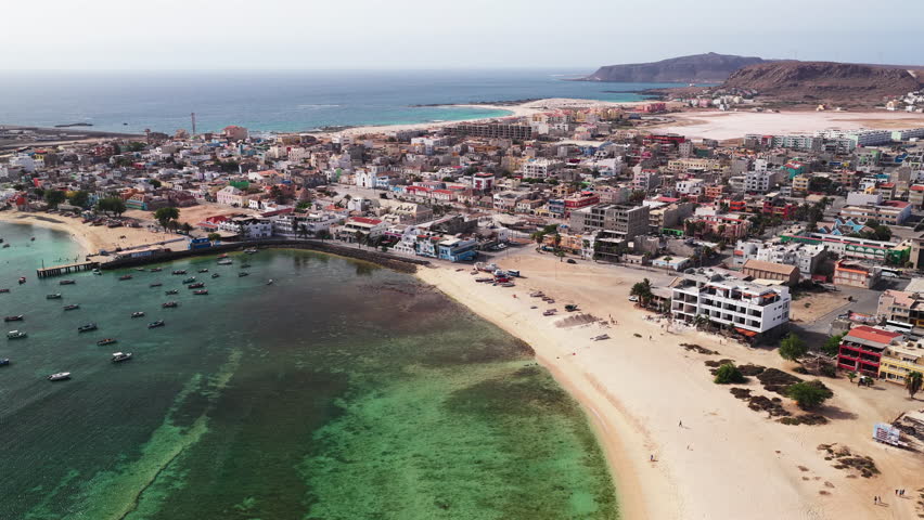 Aerial view of Sal Rei, Old city with many colorful house, turquoise ocean and sandy beach, background the desert,Boa Vista, Cape Verde