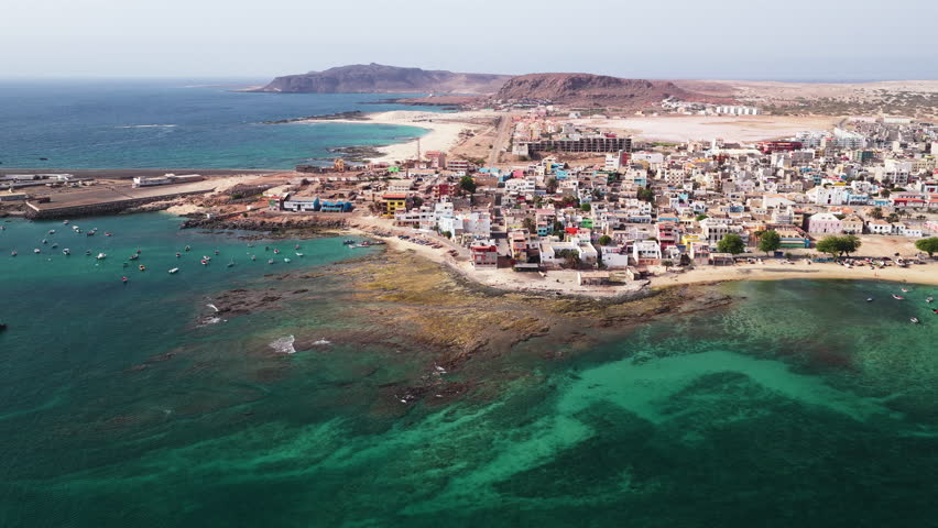 Aerial view of Sal Rei, Old city with many colorful house, small port, turquoise ocean and sandy beach, background the desert,Boa Vista, Cape Verde