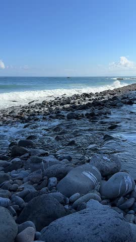 Beautiful rocky shoreline with waves crashing 