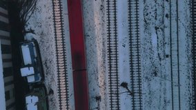 Drone flying above a moving train shows winter railway tracks, snowy platforms and infrastructure captured during a dynamic overhead shot - Powered by Shutterstock - Get 15% off with code: PIKWIZARD15