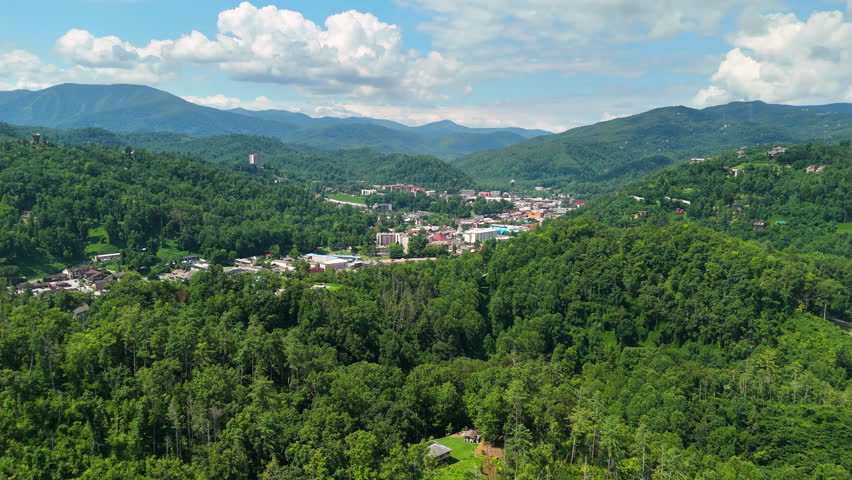 Gatlinburg, Tennessee resort town in Appalachian Mountains. Forested hills near tourist area.
