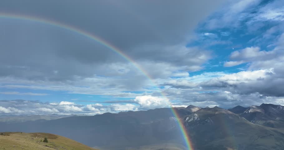 Beautiful  double rainbow after the rain on high altitude mountain top