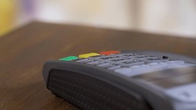 Phone is put on POS-terminal for contactless payment. Modern shopping. E-money security concept - Powered by Shutterstock - Get 15% off with code: PIKWIZARD15