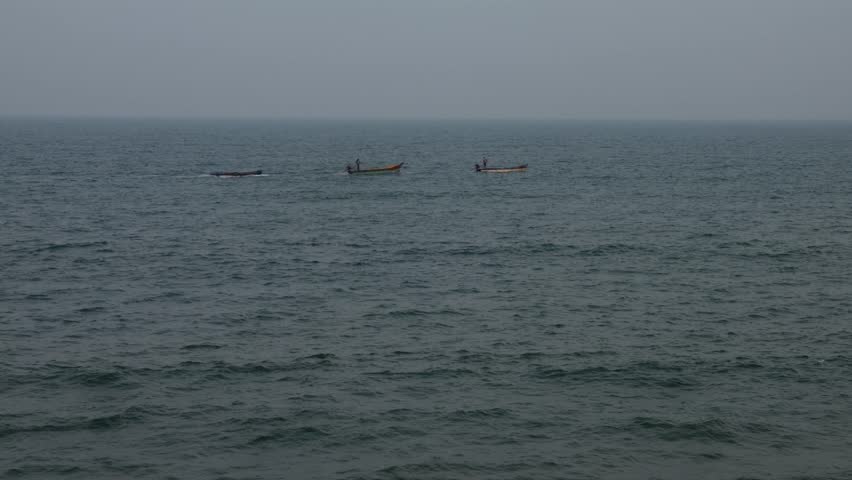 FIshing boat docks on the shore at dawn. Slow motion 4K