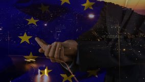 Suited hand presenting globe appearing above palm, rotating with EU stars and lights showing unity. Orb, flags, european, minimal, broadcast, urban, night - Powered by Shutterstock - Get 15% off with code: PIKWIZARD15