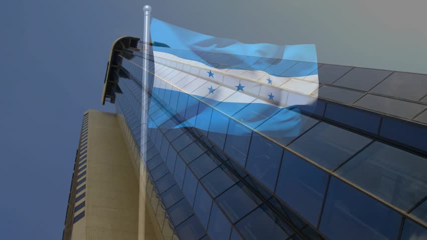 Wind gusting, national flag rippling across high-rise facade, revealing and hiding reflective glass. Banner, ensign, cityscape, downtown, skyscraper, stripes, stars