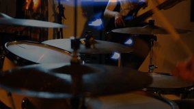 Drummer sticks entering frame, cymbal stack being struck, light flares sweeping in rehearsal. Cymbals, drums, studio, duo, motion, blur, glow - Powered by Shutterstock - Get 15% off with code: PIKWIZARD15