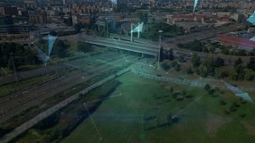 Polygons appearing over park and railyard converging into rotating 3D globe showing urban network. Aerial, cityscape, holographic, overlay, grid, nodes, transit - Powered by Shutterstock - Get 15% off with code: PIKWIZARD15